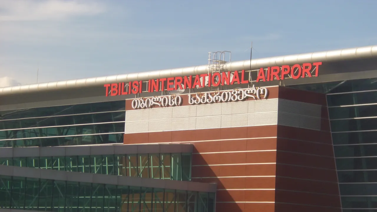 Terminal of Tbilisi International Airport with signage
