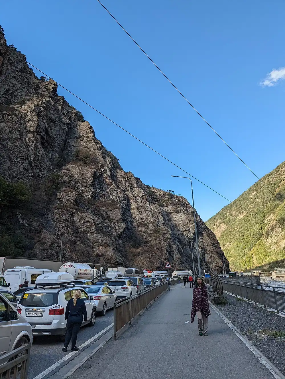 Line of cars queued at the Verkhny Lars border checkpoint on the Georgian Military Road