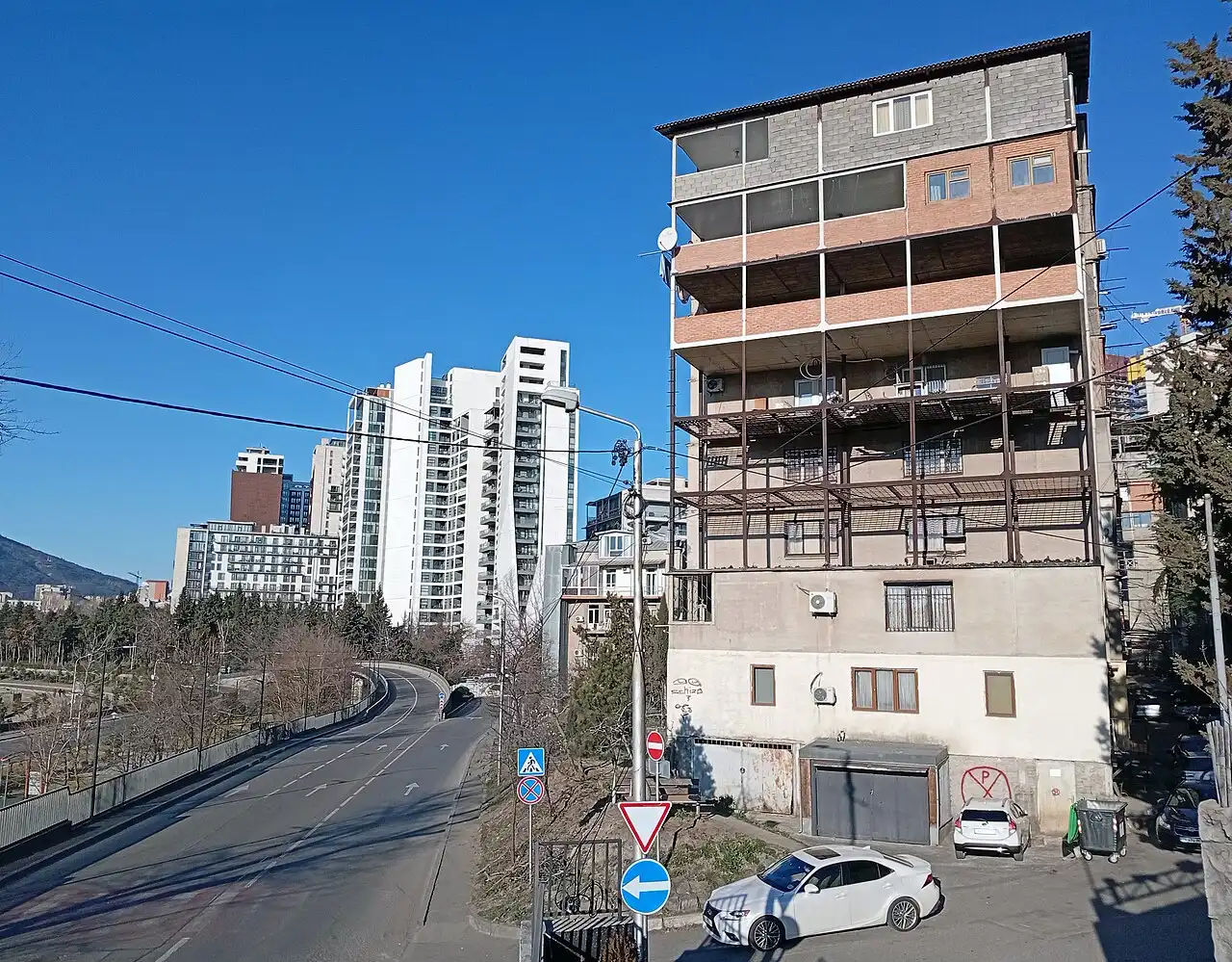 A Tbilisi city street with parked cars
