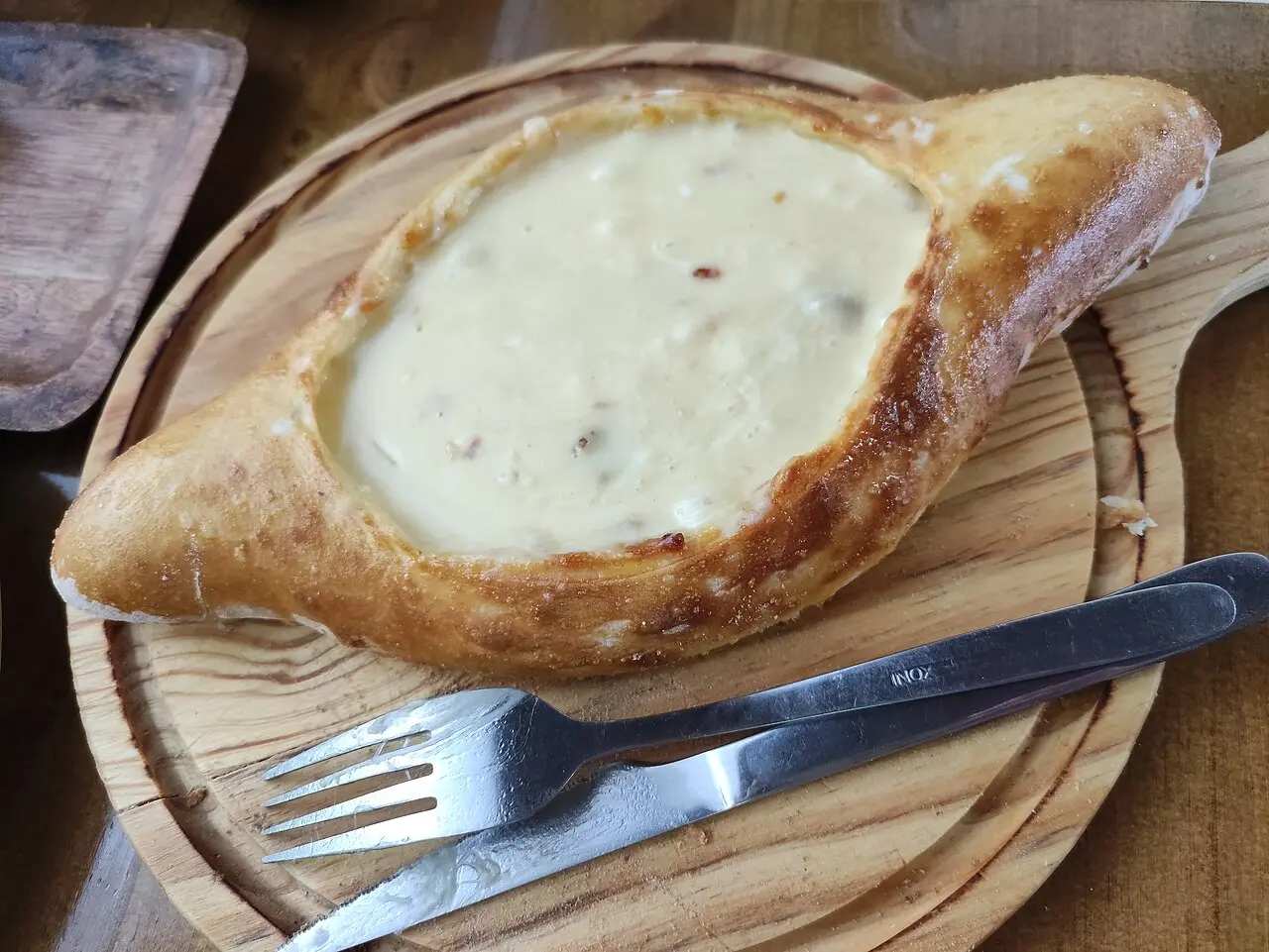Adjarian khachapuri — a boat of dough with cheese and egg