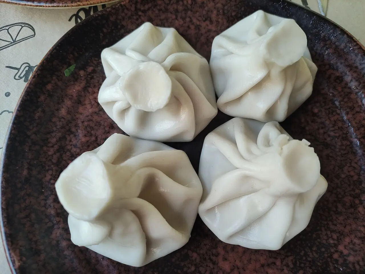 Georgian khinkali dumplings on a plate