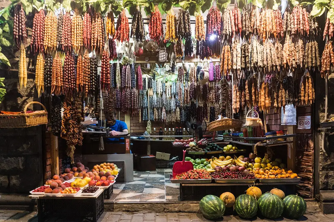 Churchkhela and fruit at a market in Tbilisi