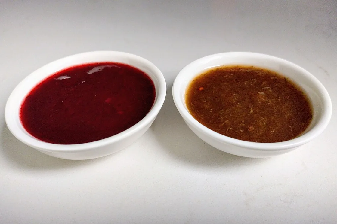 Bowls of red and brown tkemali, the Georgian sour-plum sauce