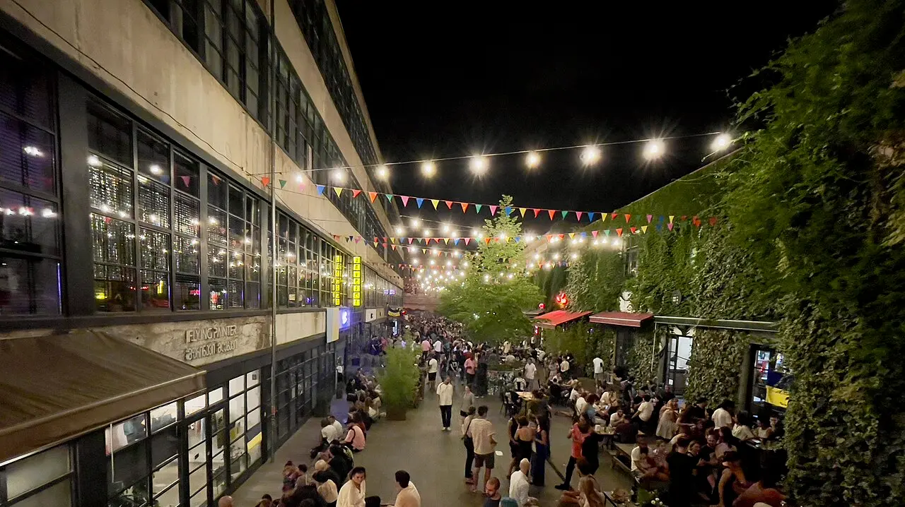 The Fabrika courtyard in Tbilisi at night, with string lights and people