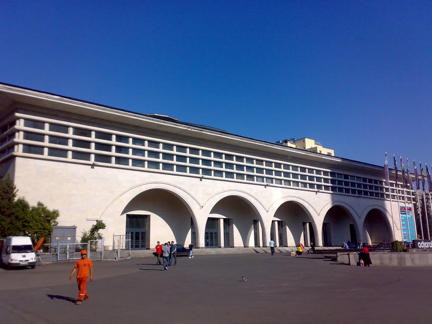 The arcaded facade of the Tbilisi Sports Palace on a sunny day