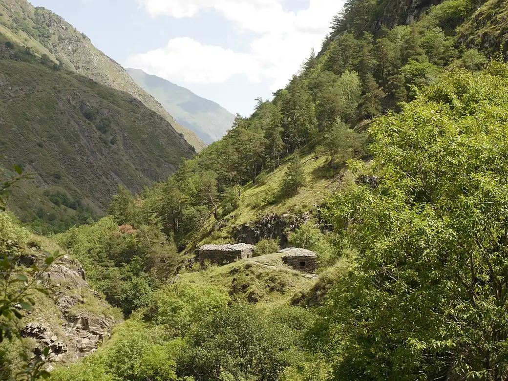 The stone plague crypts of Anatori on a slope above the river