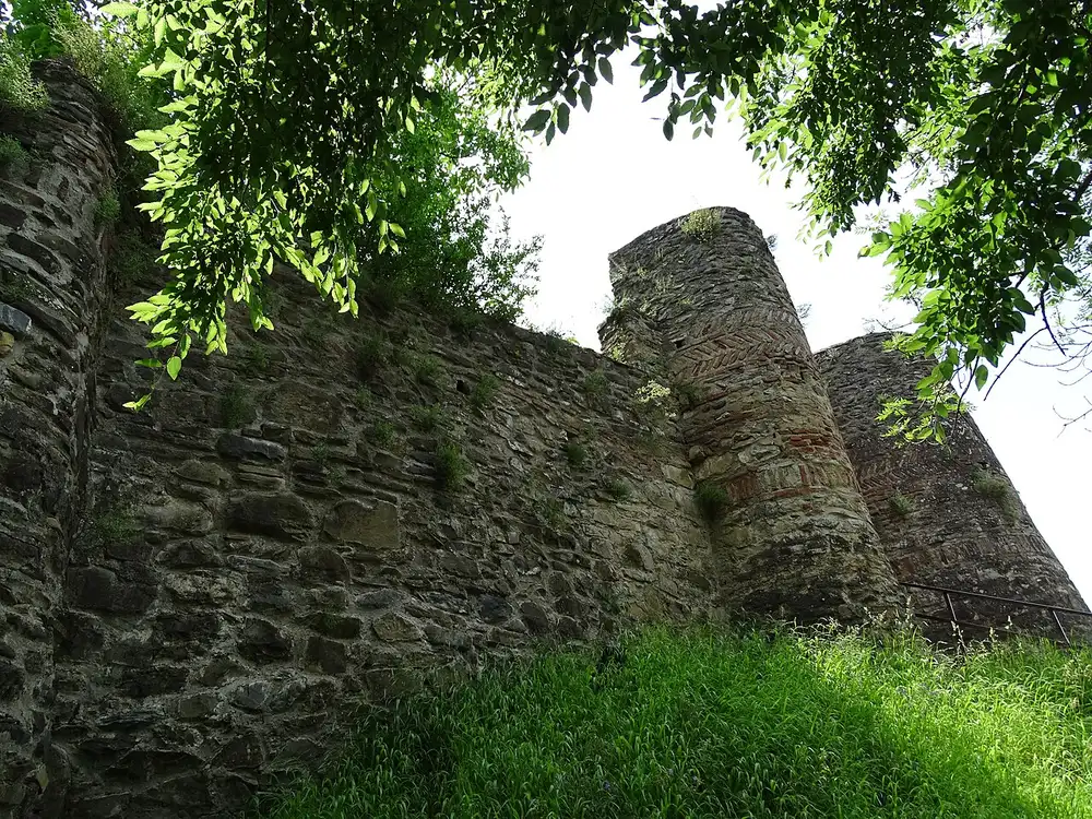 Stone walls of the Gremi citadel with round towers and patterned brickwork