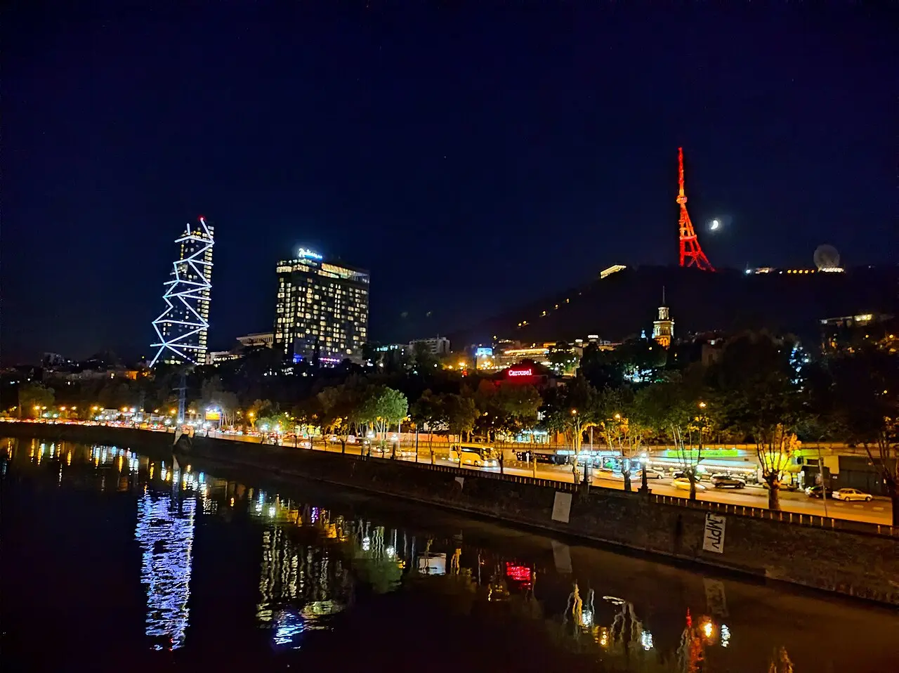 The Kura riverside in Tbilisi at night, lit up