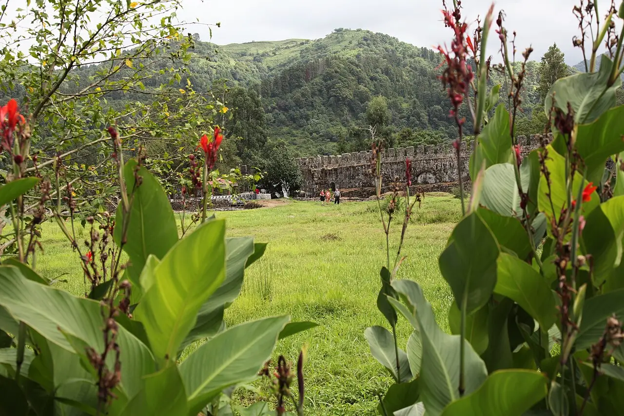 The restored wall of the Gonio-Apsaros fortress below the green hills of Adjara