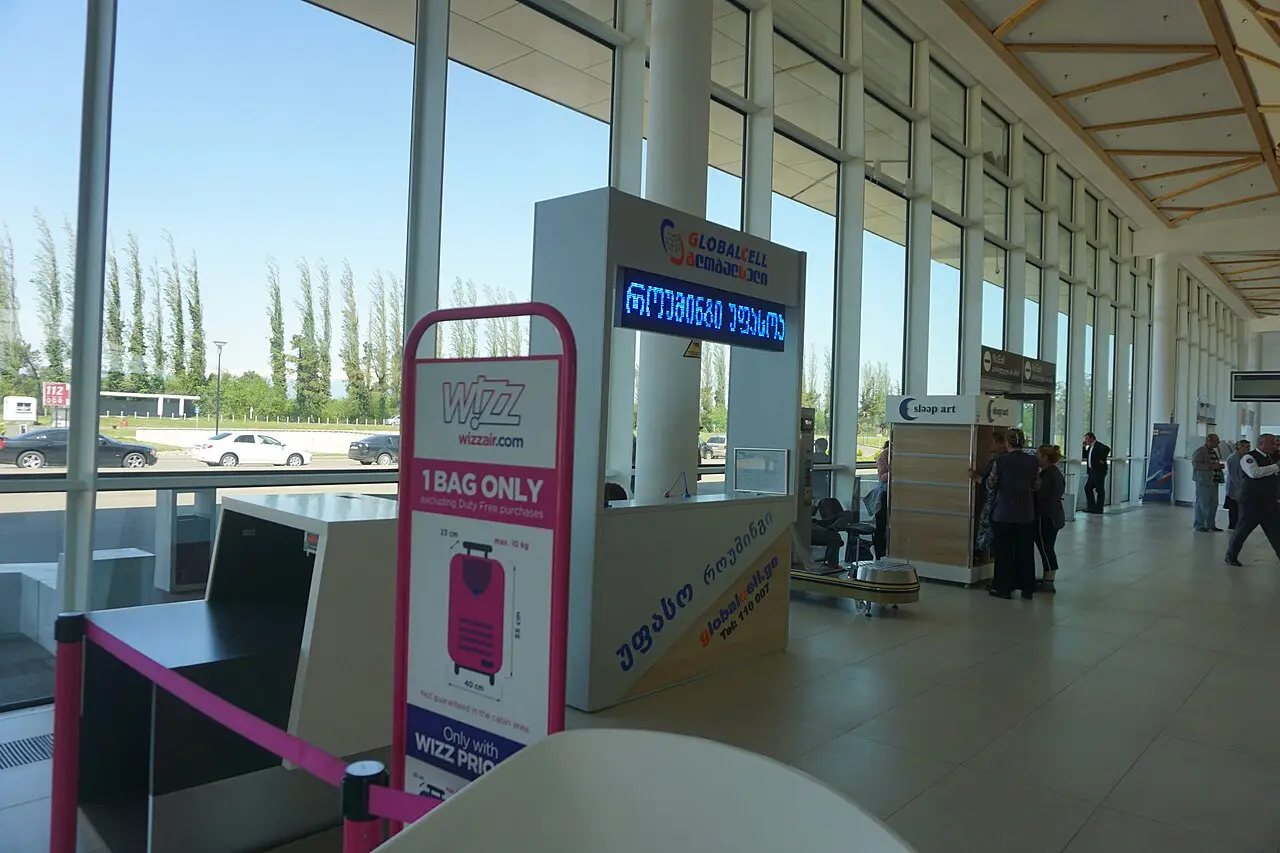 Kutaisi airport hall with a Wizz Air cabin-bag size frame for hand luggage