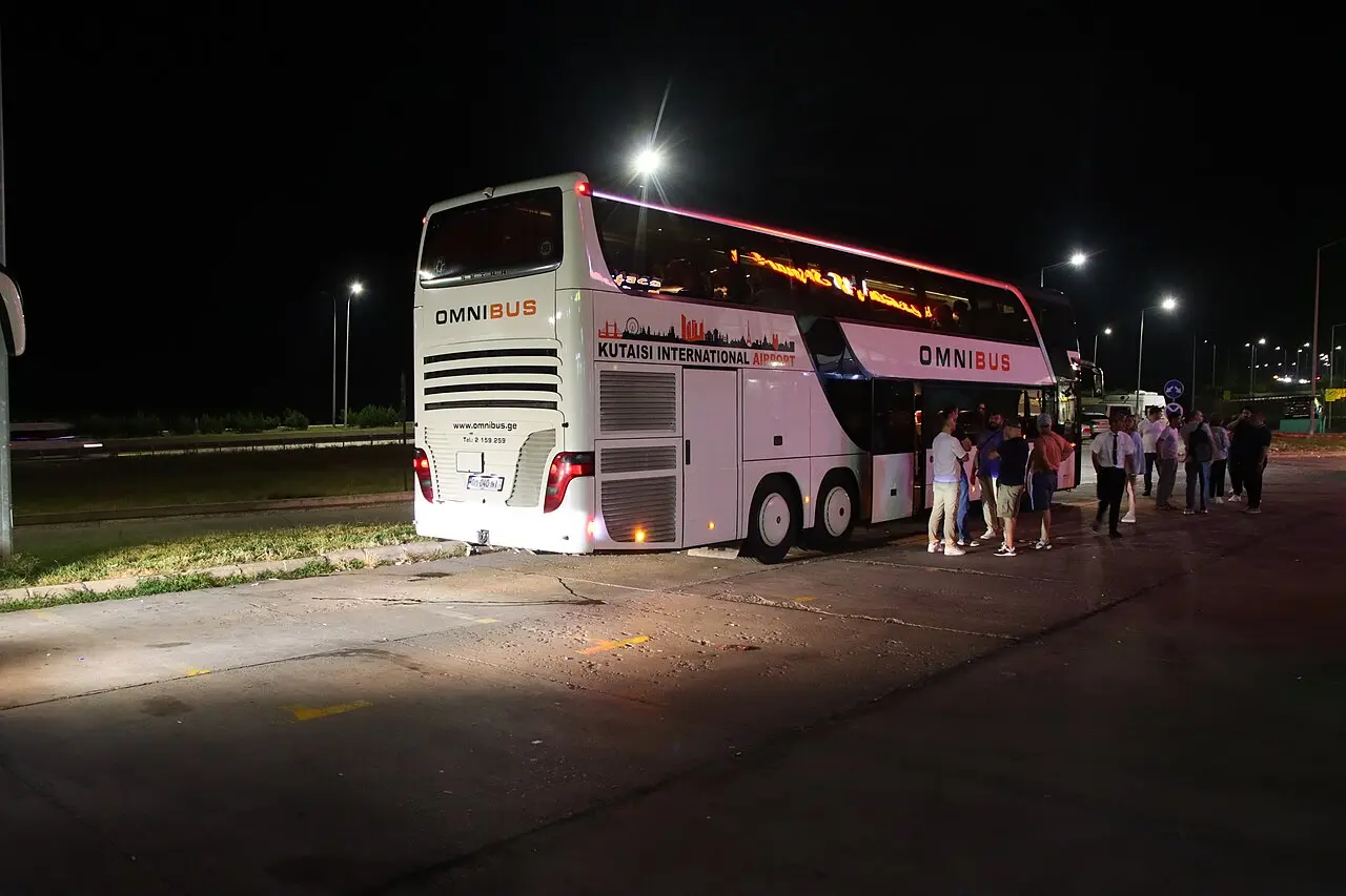 An intercity bus in Georgia parked at a stop