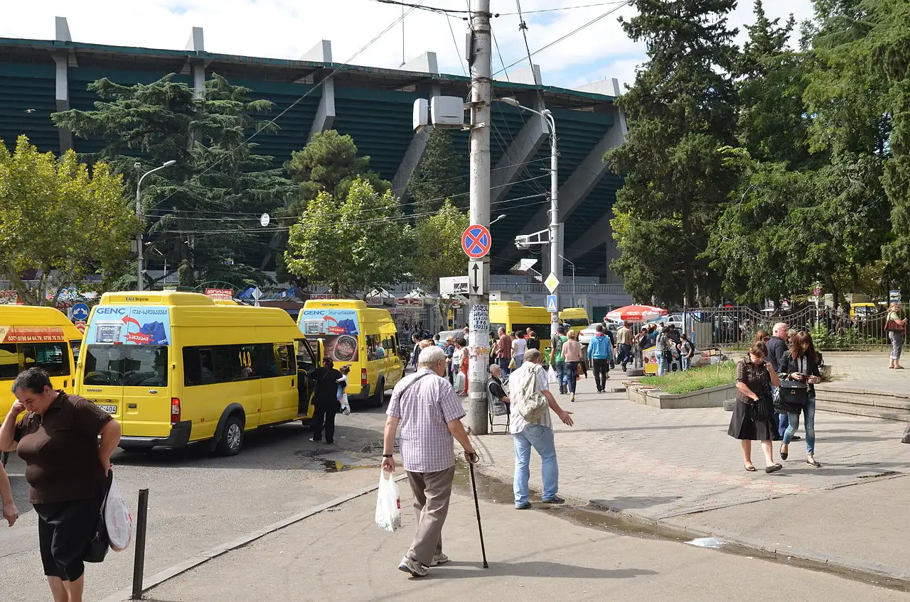 Yellow marshrutka minibuses at a stop in Tbilisi