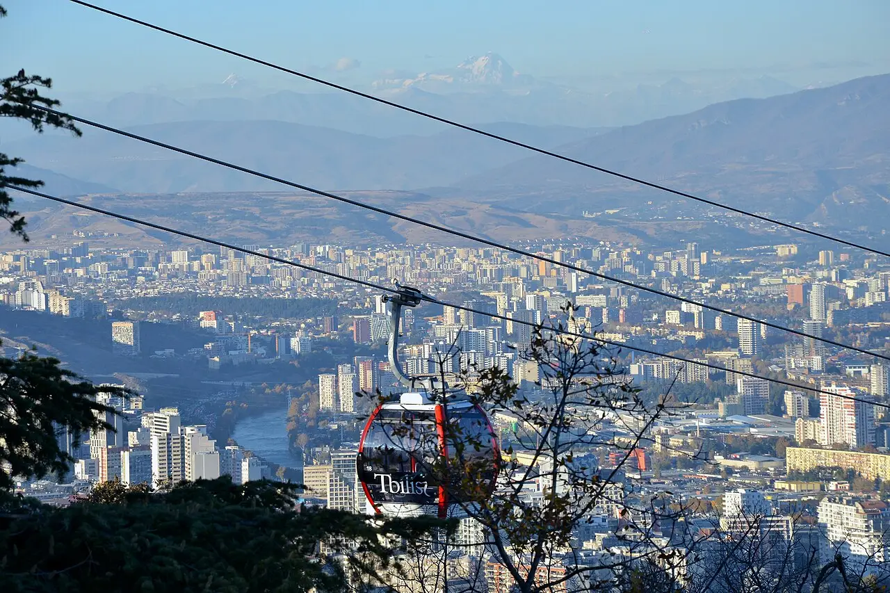 A red funicular cabin above Tbilisi on the way up Mtatsminda