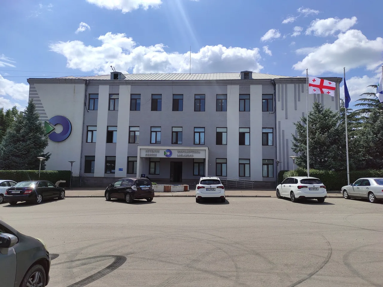 The Revenue Service of Georgia building in Tbilisi with the Georgian flag