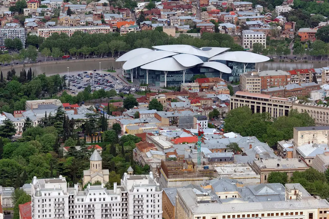 The Public Service Hall in Tbilisi, a building with a petal-shaped roof by the Kura river
