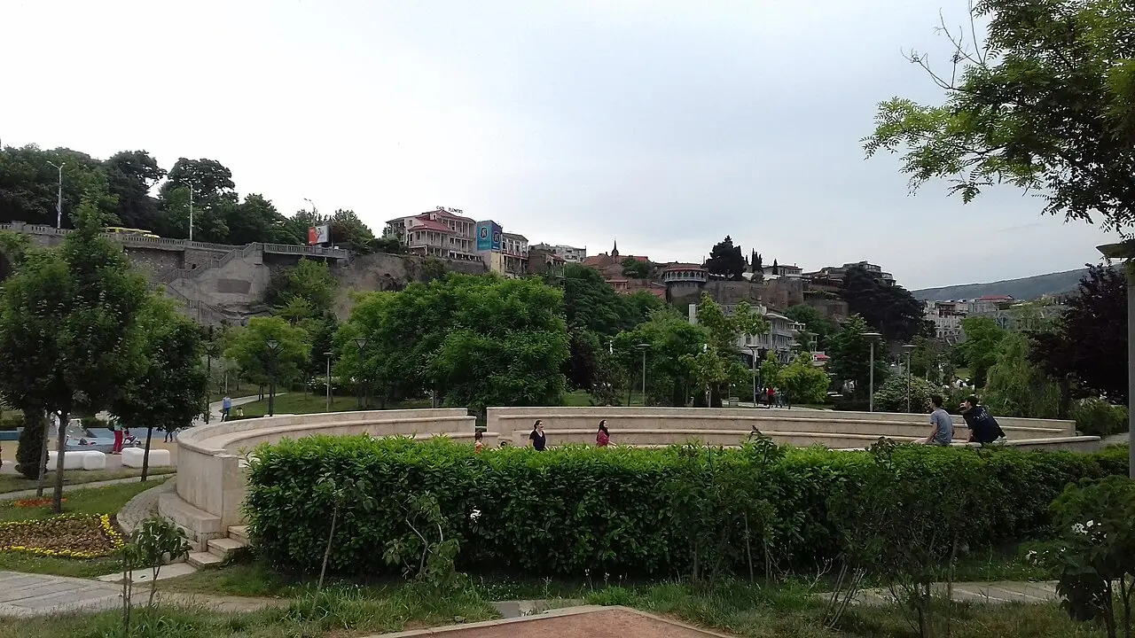 Green terraces of Rike Park with the Old Town and Narikala behind