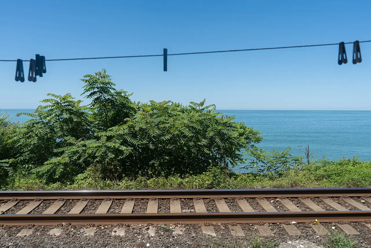 Turquoise sea at Chakvi and the coastal railway