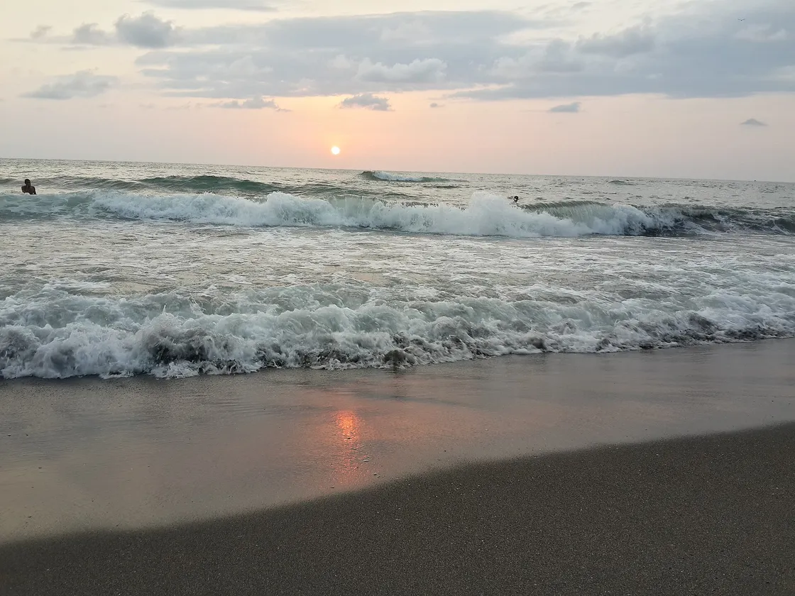 Sunset over the wide sandy shore of Ureki on the Black Sea