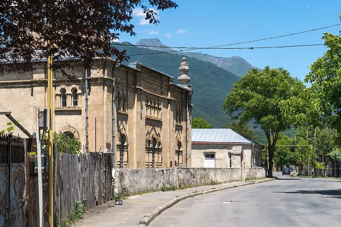 The old Oni synagogue in Neo-Moorish style on a quiet street below the mountains