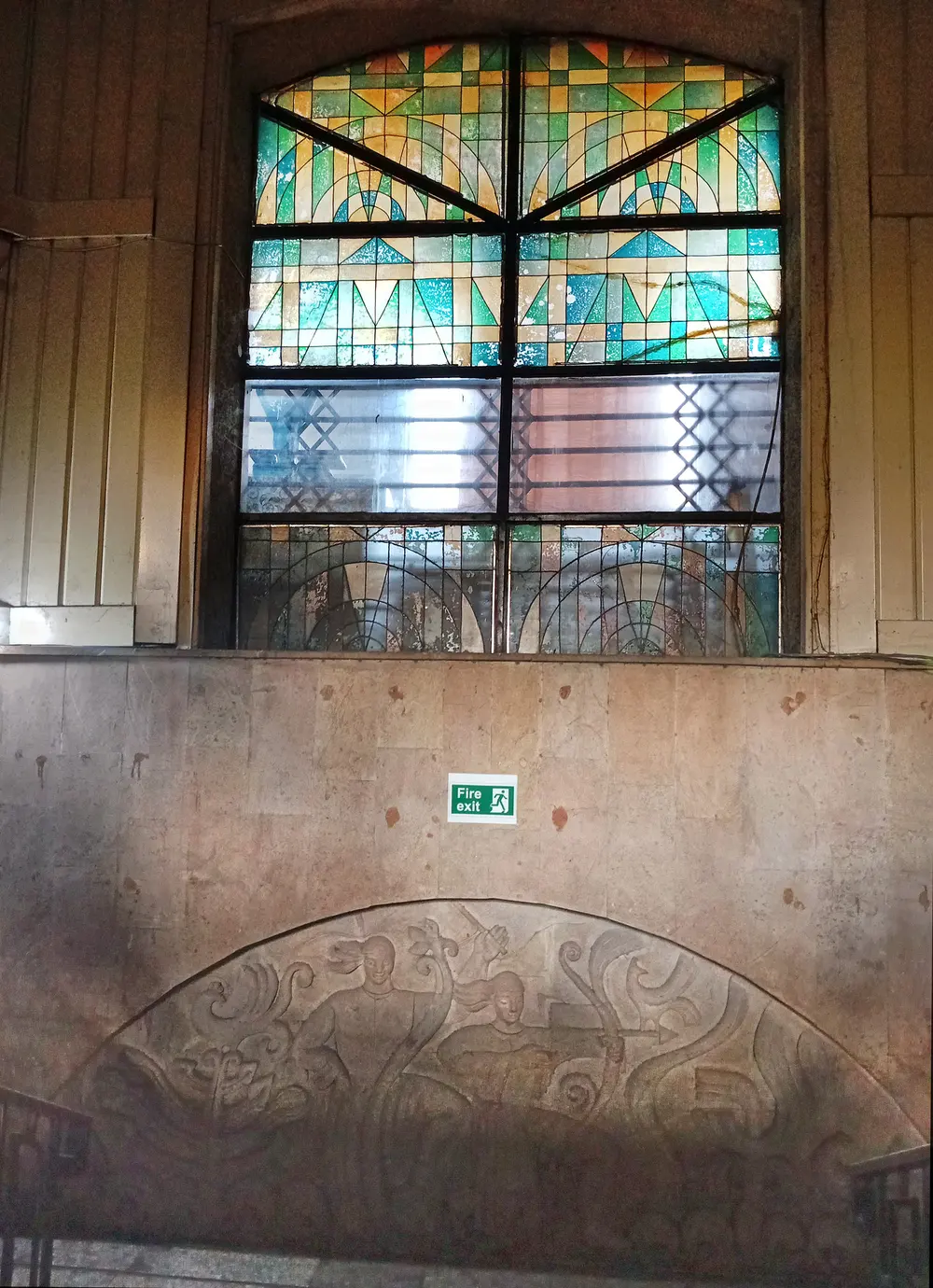 Stained-glass window and relief inside the Dezerter Bazaar building (133 Tsinamdzghvrishvili St)