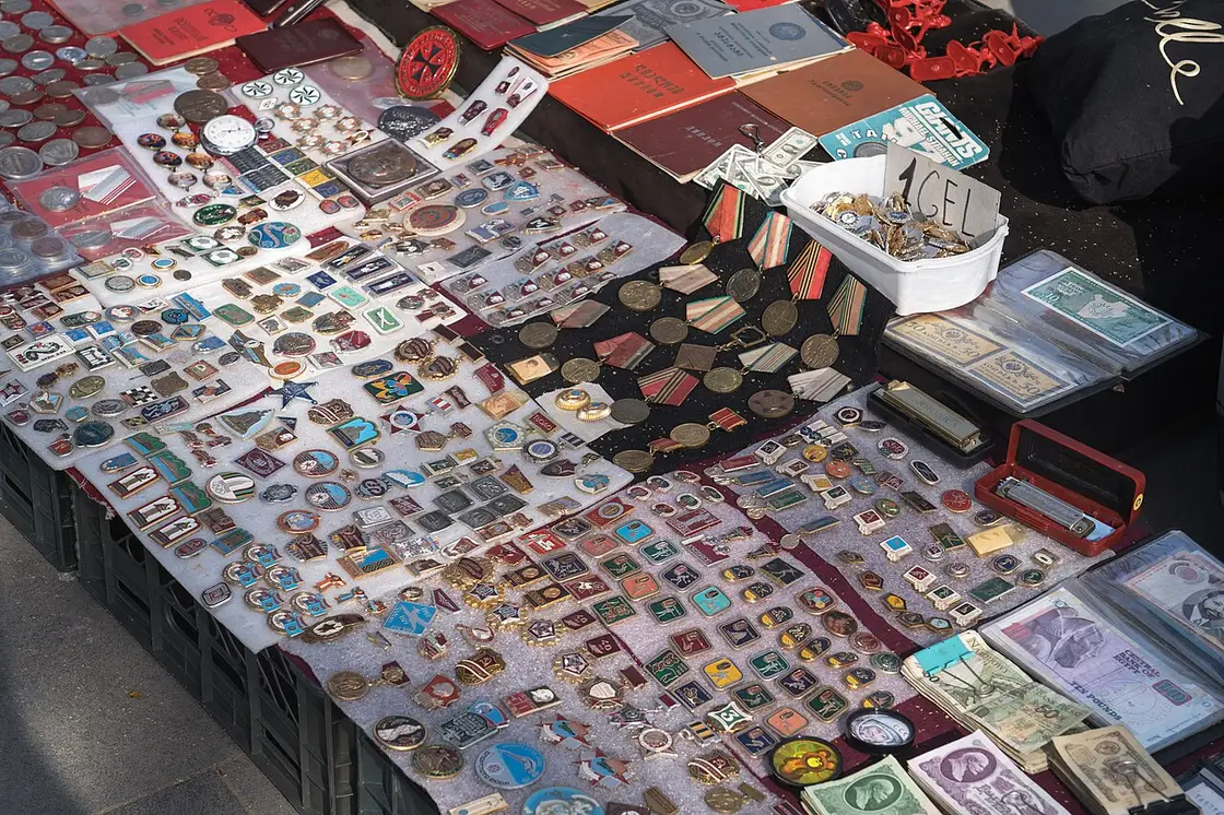 Coins, pins and medals on a stall at the Dry Bridge flea market