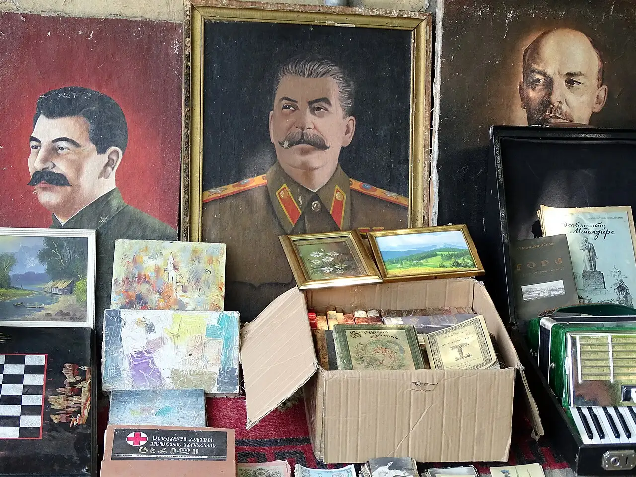 Portraits of Stalin and Lenin among old items at the Dry Bridge