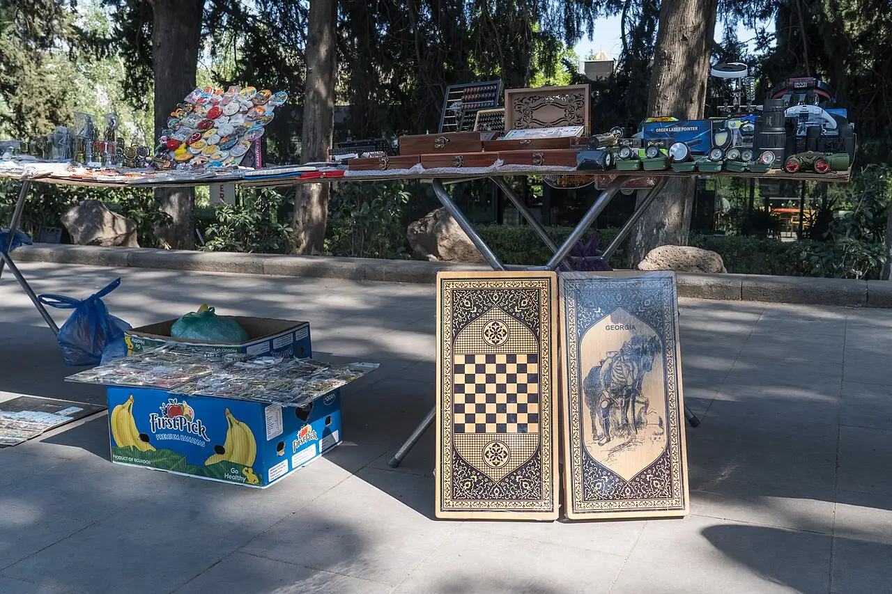 Old backgammon boards and painted boxes at the flea market