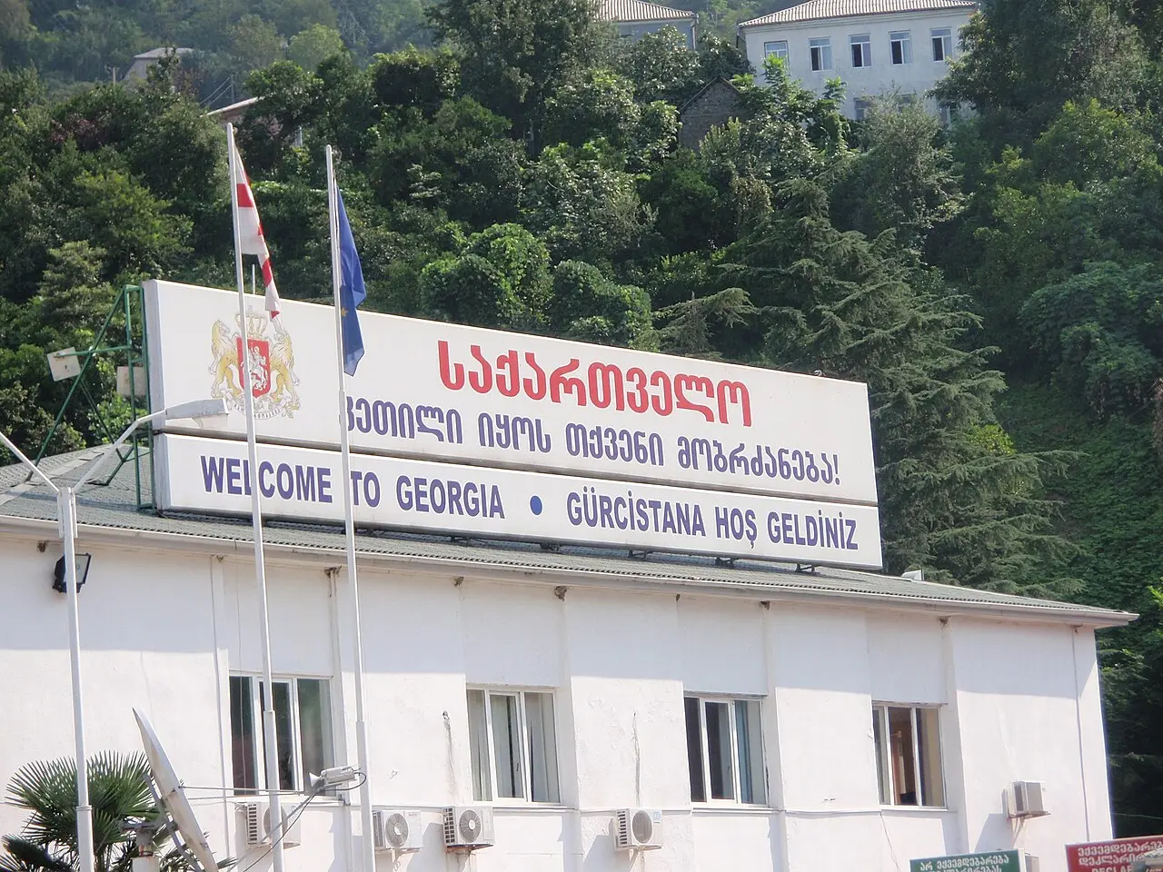A Welcome to Georgia sign on the building of the Sarpi border checkpoint