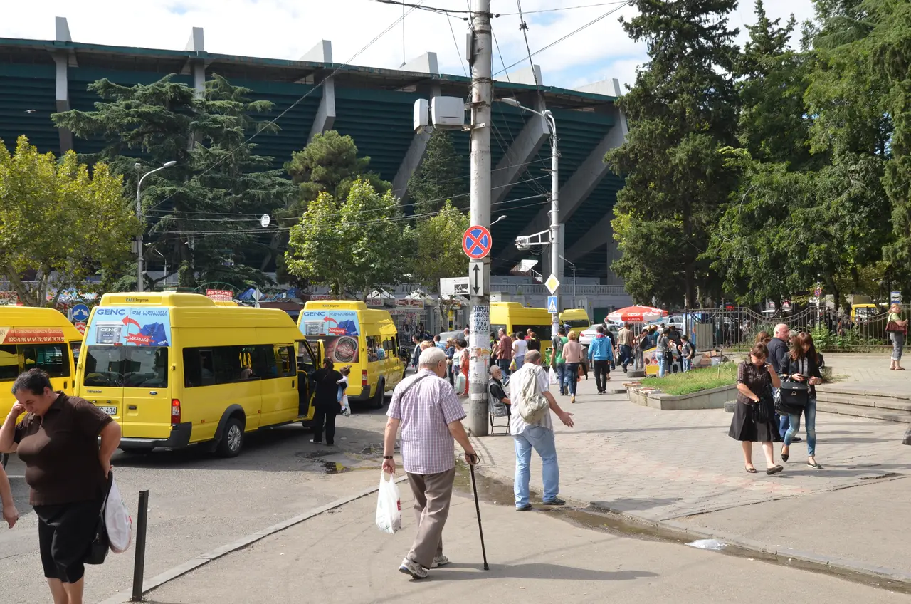 Yellow marshrutka minibuses at a stop in Tbilisi