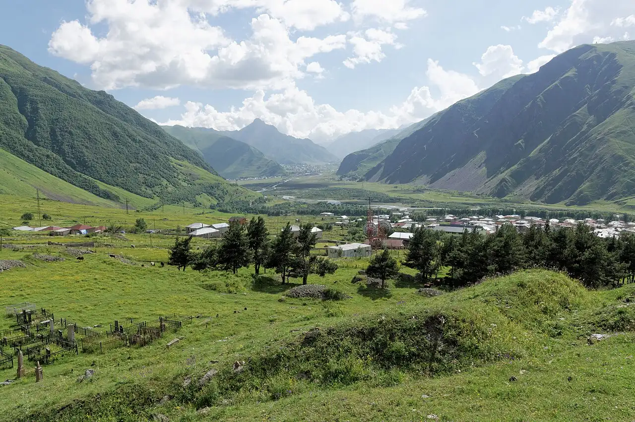 The green Terek valley near Stepantsminda ringed by mountains