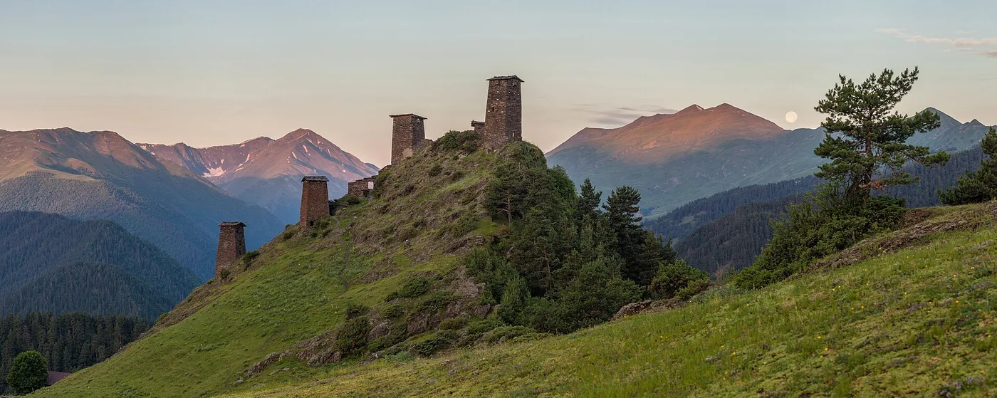 The stone towers of Keselo fortress on a hill above Omalo at sunset